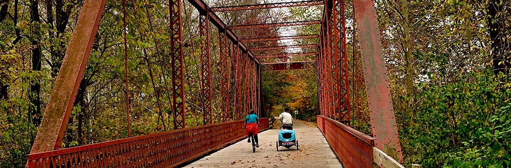 The Clear Creek Trail Metal Bridge with Cyclists